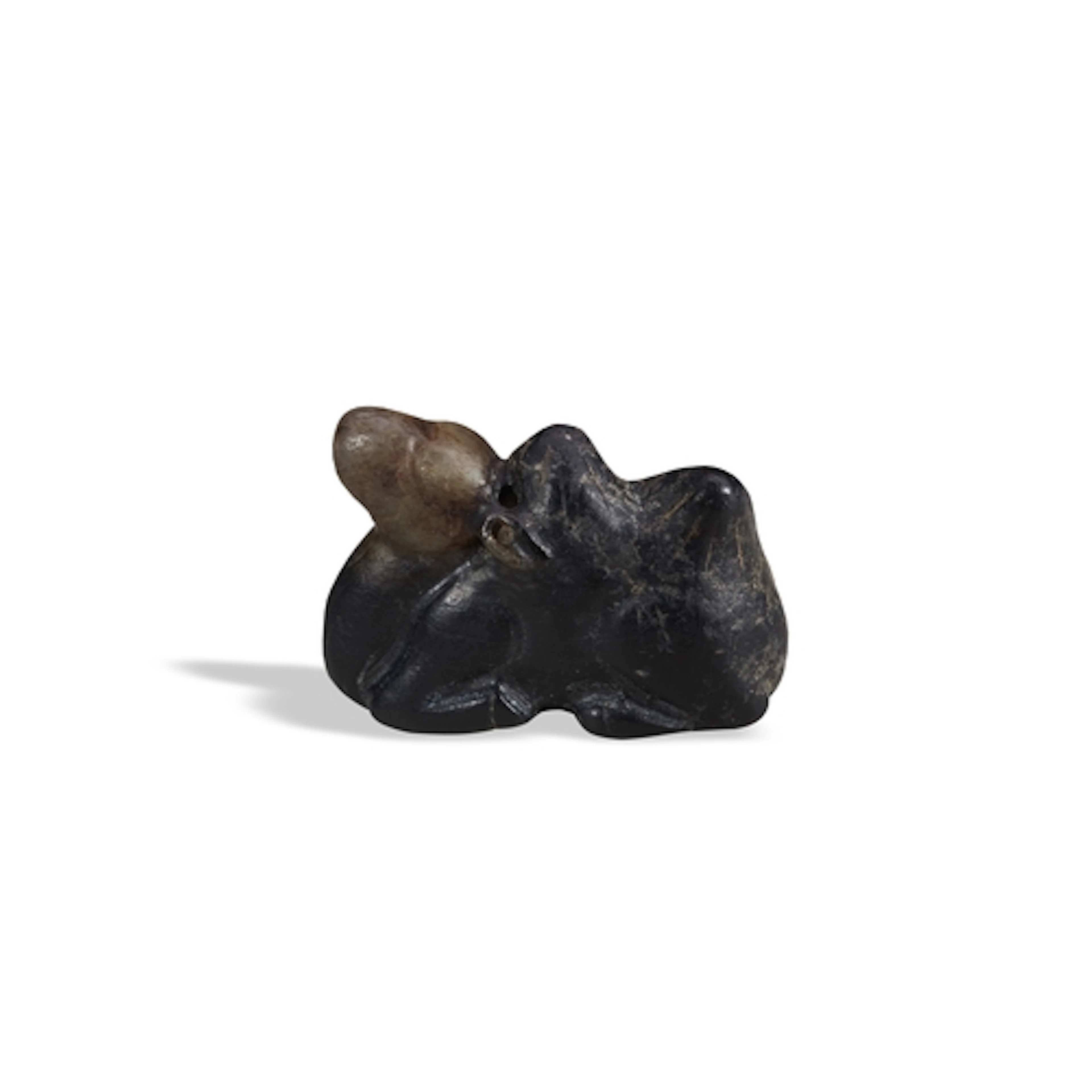 A BLACKISH-BROWN JADE FIGURE OF A CAMEL QING DYNASTY, 19TH C...