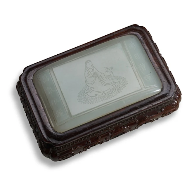 A FINE WHITE JADE PLAQUE ON A CARVED HARDWOOD STAND QING DY...