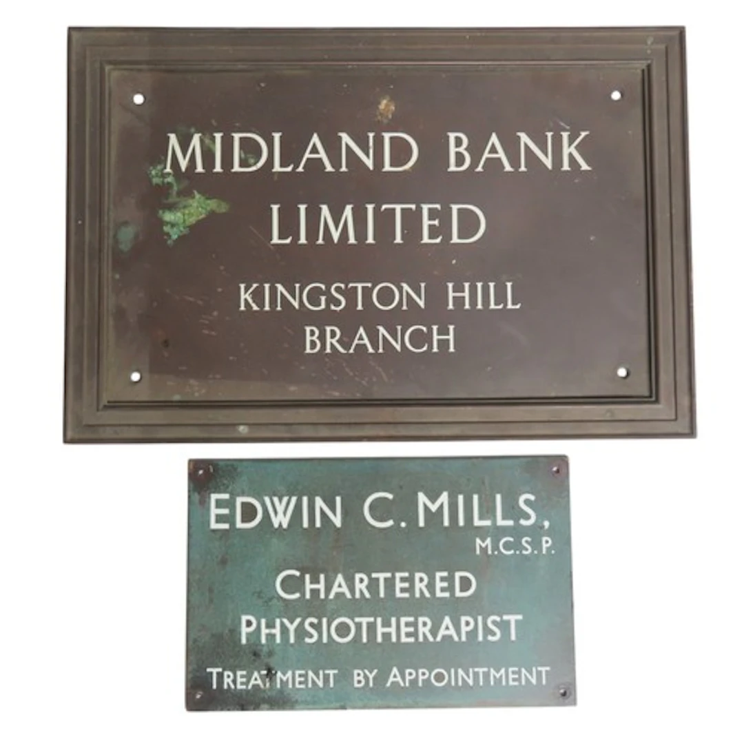 A CAST-IRON MIDLAND BANK SIGN CIRCA 1920 (31 x 46 cm), toget...