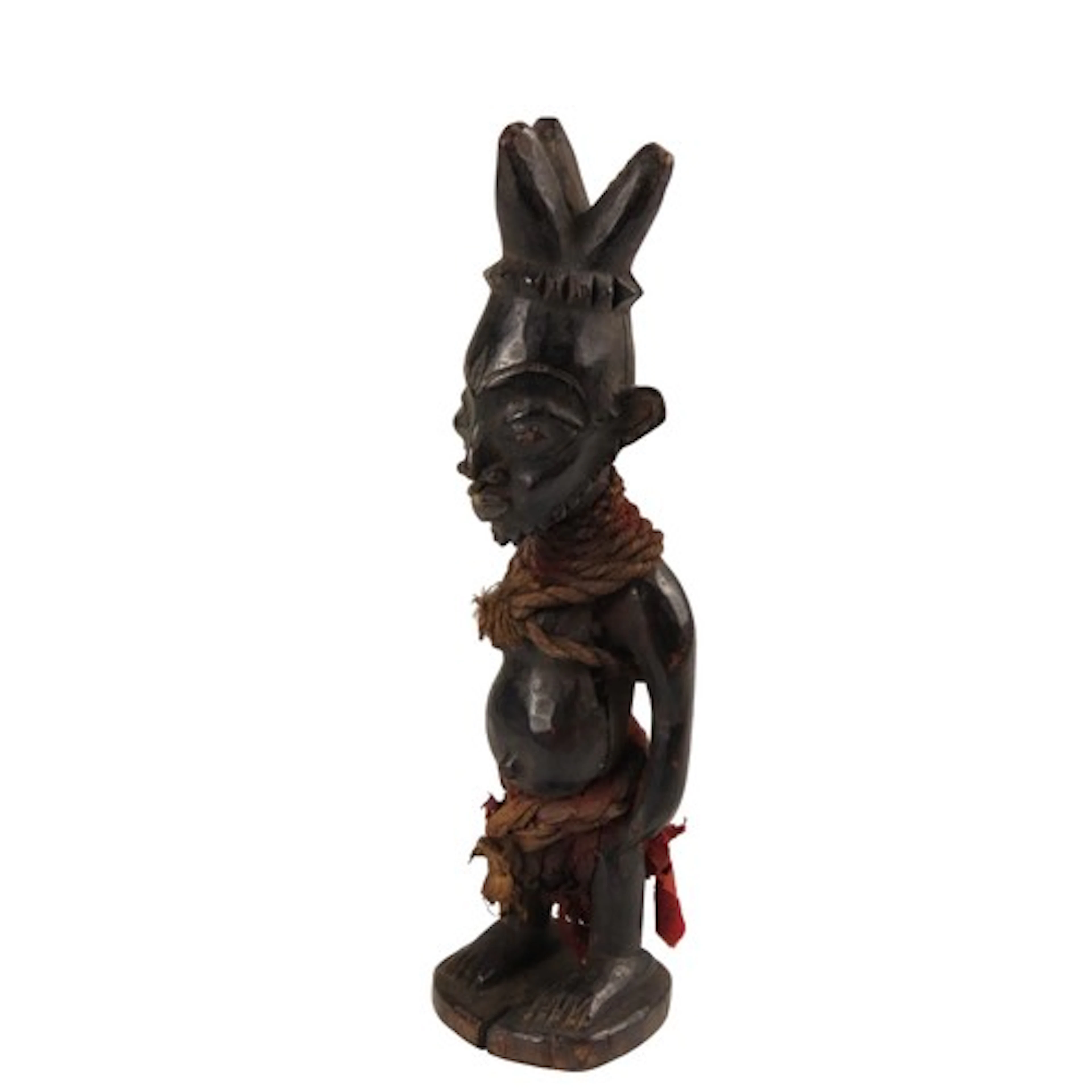 AN OLD YORUBA EBEJI FIGURE, or 'twin' figure, carved wood wi...