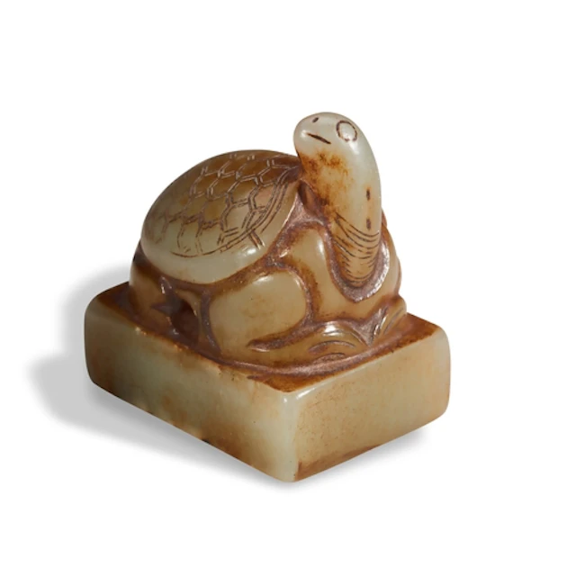 A CARVED CELADON JADE TORTOISE SEAL QING DYNASTY, 19TH CENT...
