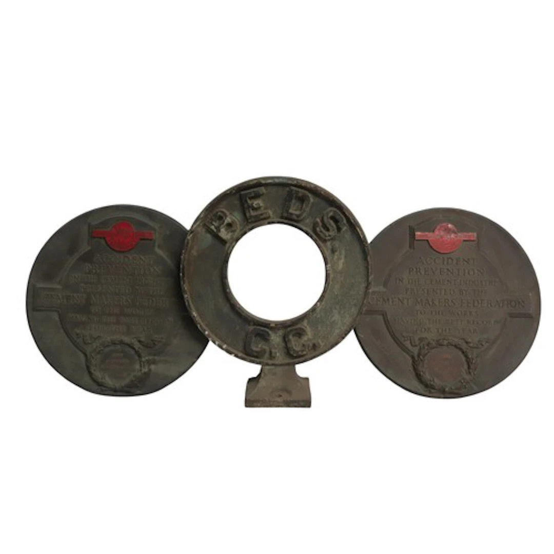 A CAST IRON RING FORM SIGN inscribed 'BEDS C.C' together wi...