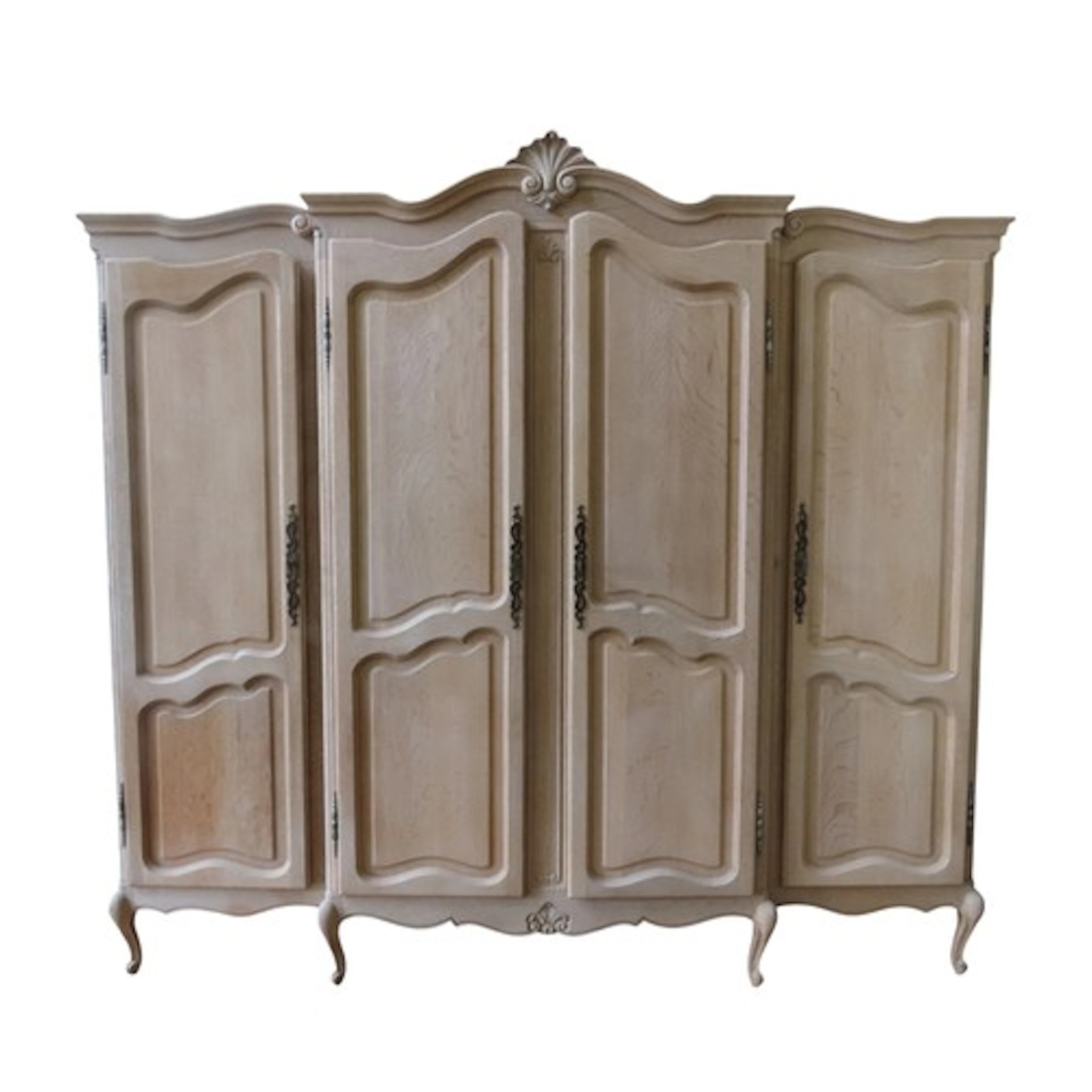 A VINTAGE FRENCH OAK FOUR DOOR WARDROBE the scrolling ogee p...