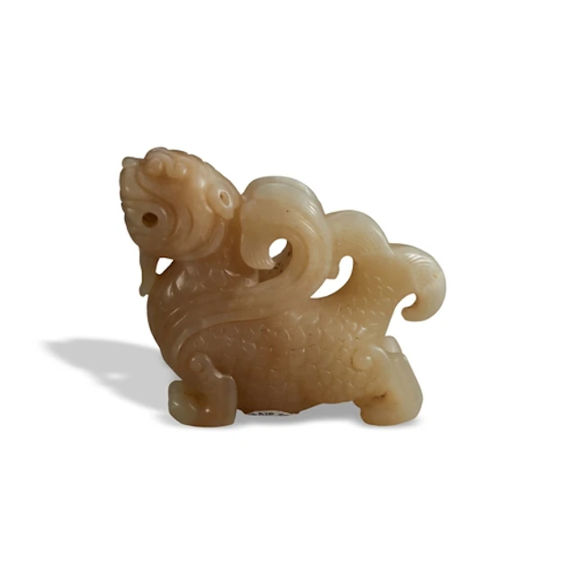 A YELLOW AND PALE-RUSSET 'DRAGON-FISH' QING DYNASTY, 19TH CE...