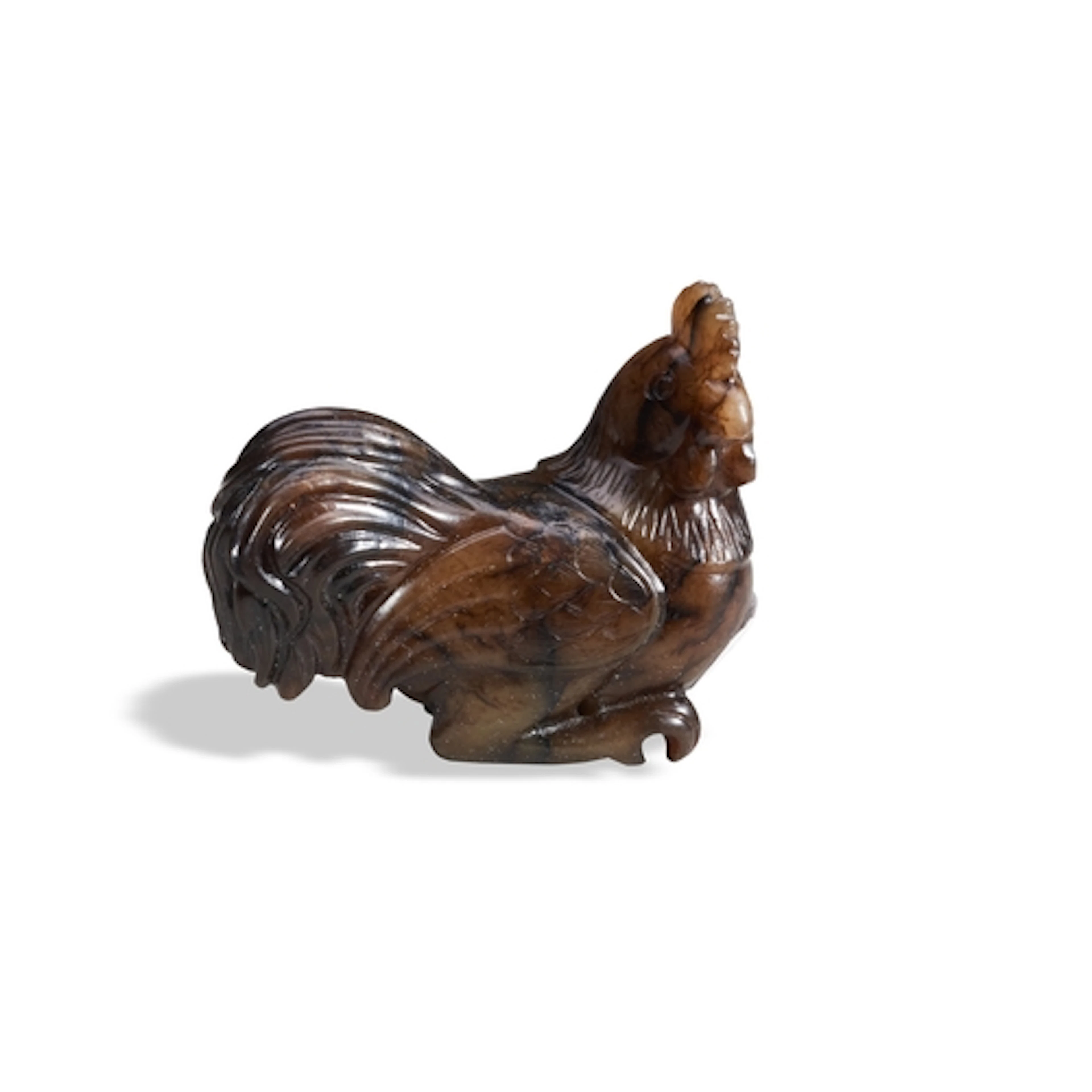 A MOTTLED-BROWN JADE FIGURE OF A COCKEREL OR ROOSTER QING DY...