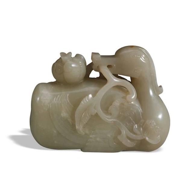 A CELADON JADE OF GOOSE 20TH CENTIRY 青白玉鹤衔灵芝 二十世纪 Carved re...