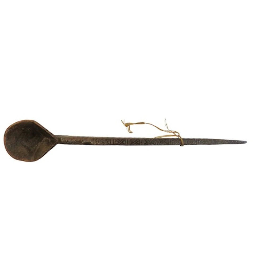 AN AFGHAN WOODEN SPOON with notch carved decoration, with da...