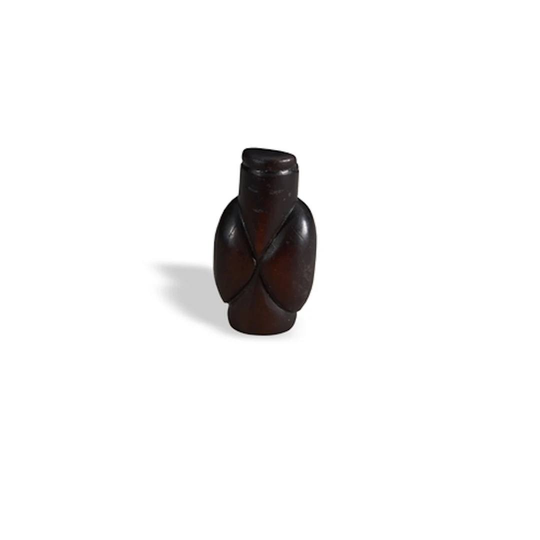 A DARK BROWN ARCHAISTIC BEAD OR PENDANT 19TH CENTURY 墨玉仲翁 十九...