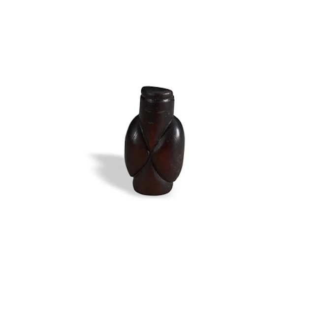 A DARK BROWN ARCHAISTIC BEAD OR PENDANT 19TH CENTURY 墨玉仲翁 十九...