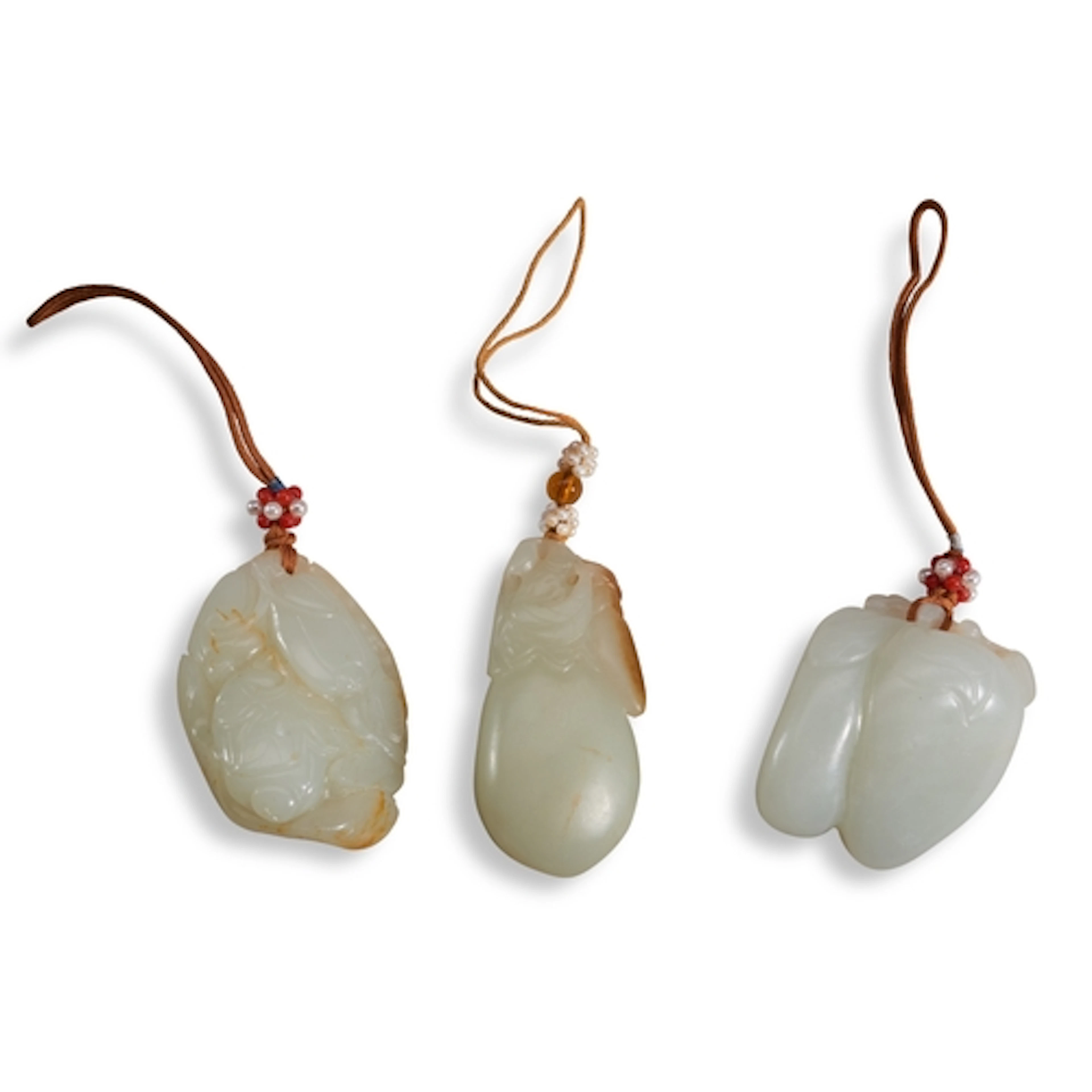 THREE WHITE JADE PENDANTS 19TH / 20TH CENTURY 青白玉瓜果雕一组 十九/二...