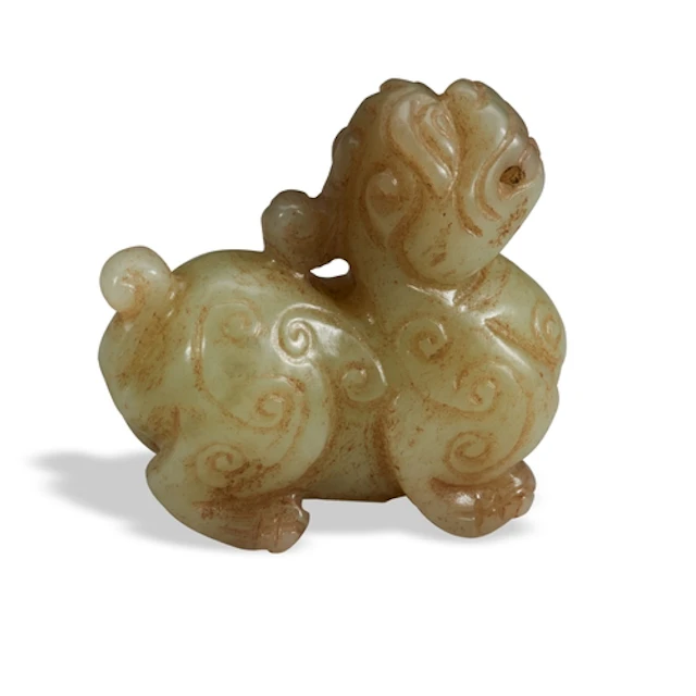 A CELADON JADE MYTHICAL BEAST 20TH CENTURY 青褐玉兽 二十世纪 depict...