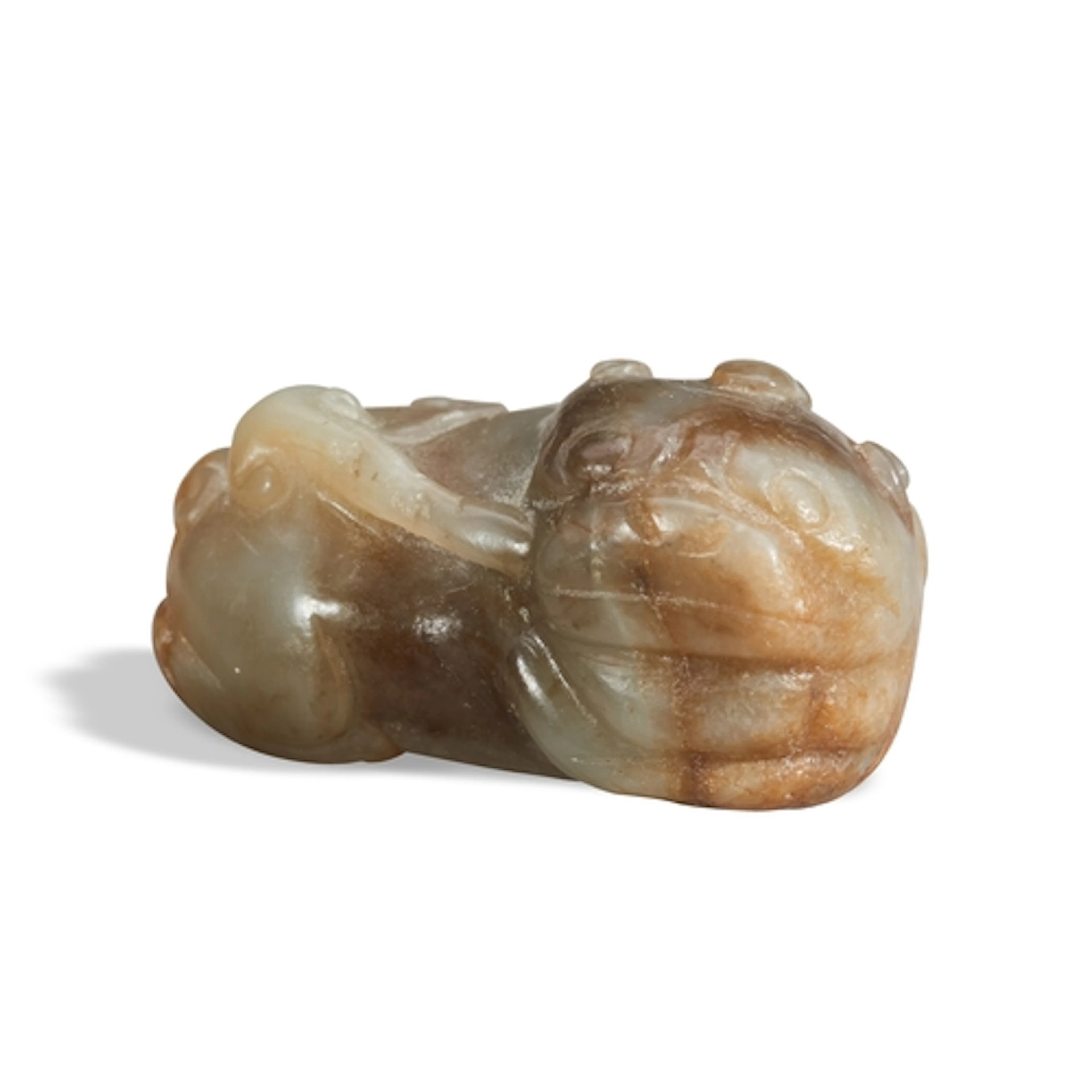 A MOTTLED CELADON-BLACK JADE MYTHOLOGICAL BEAST QING DYNAST...