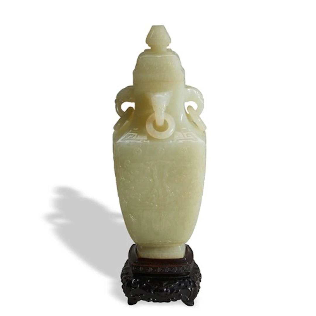 AN ARCHAISTIC CELADON JADE FOUR-SIDED 'HU' VASE WITH COVER A...