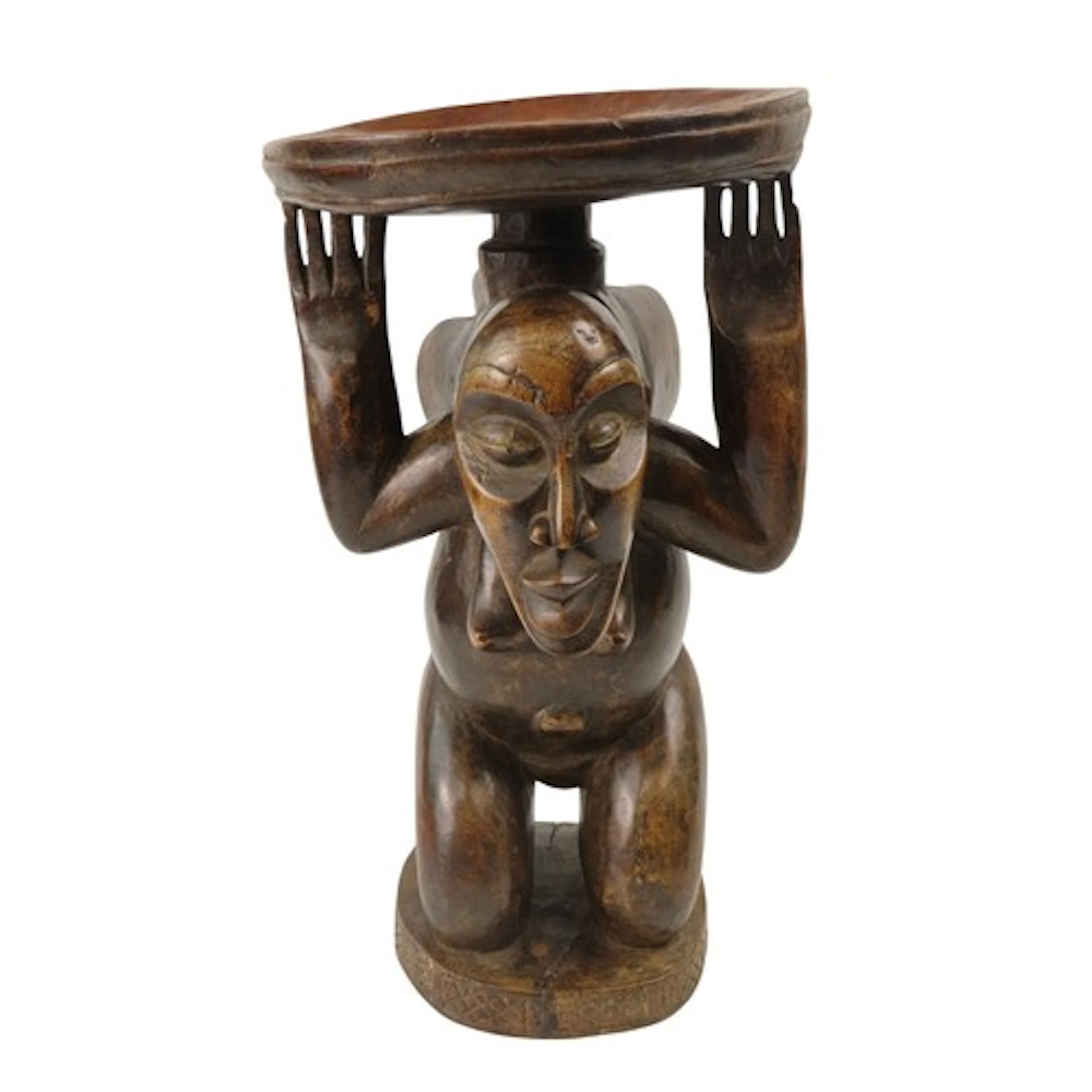 A LUBA CARVED WOODEN STOOL of a kneeling female figure, her ...