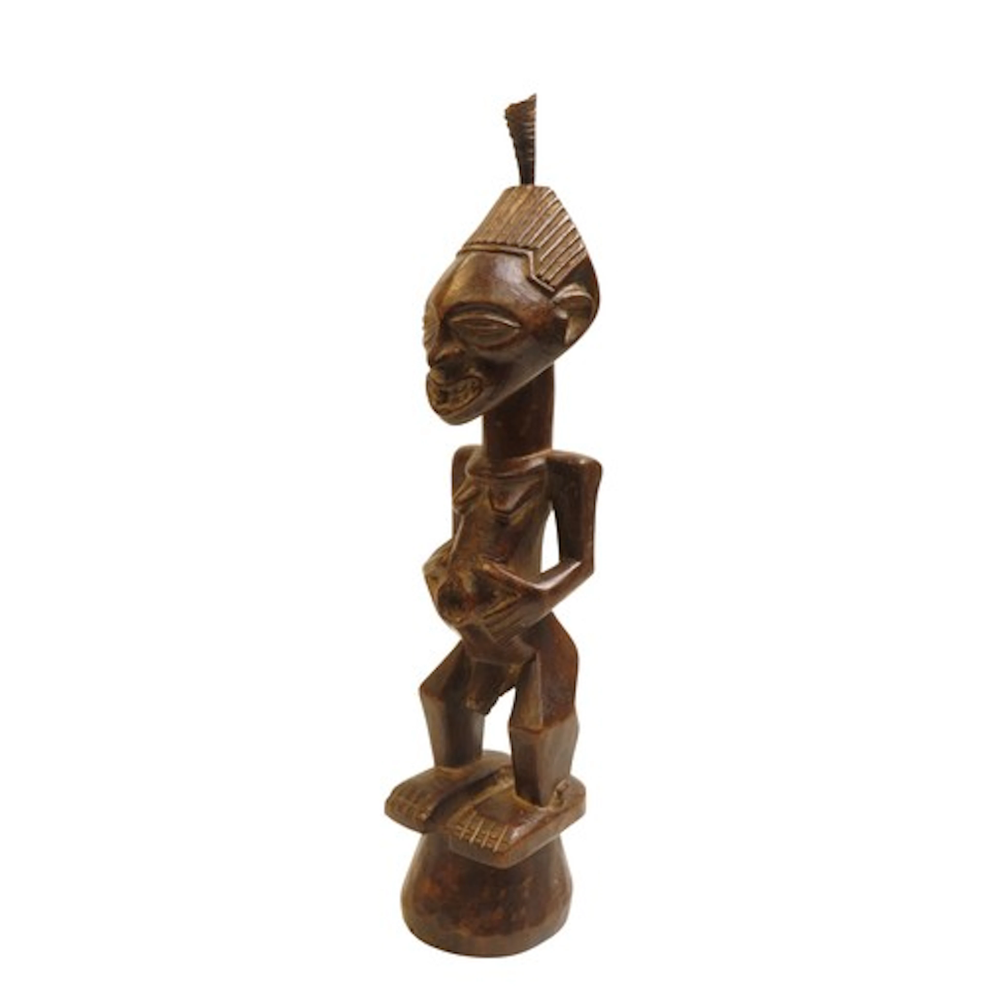 A SONGYE NKISI FIGURE, finely carved, her hair inset with a ...
