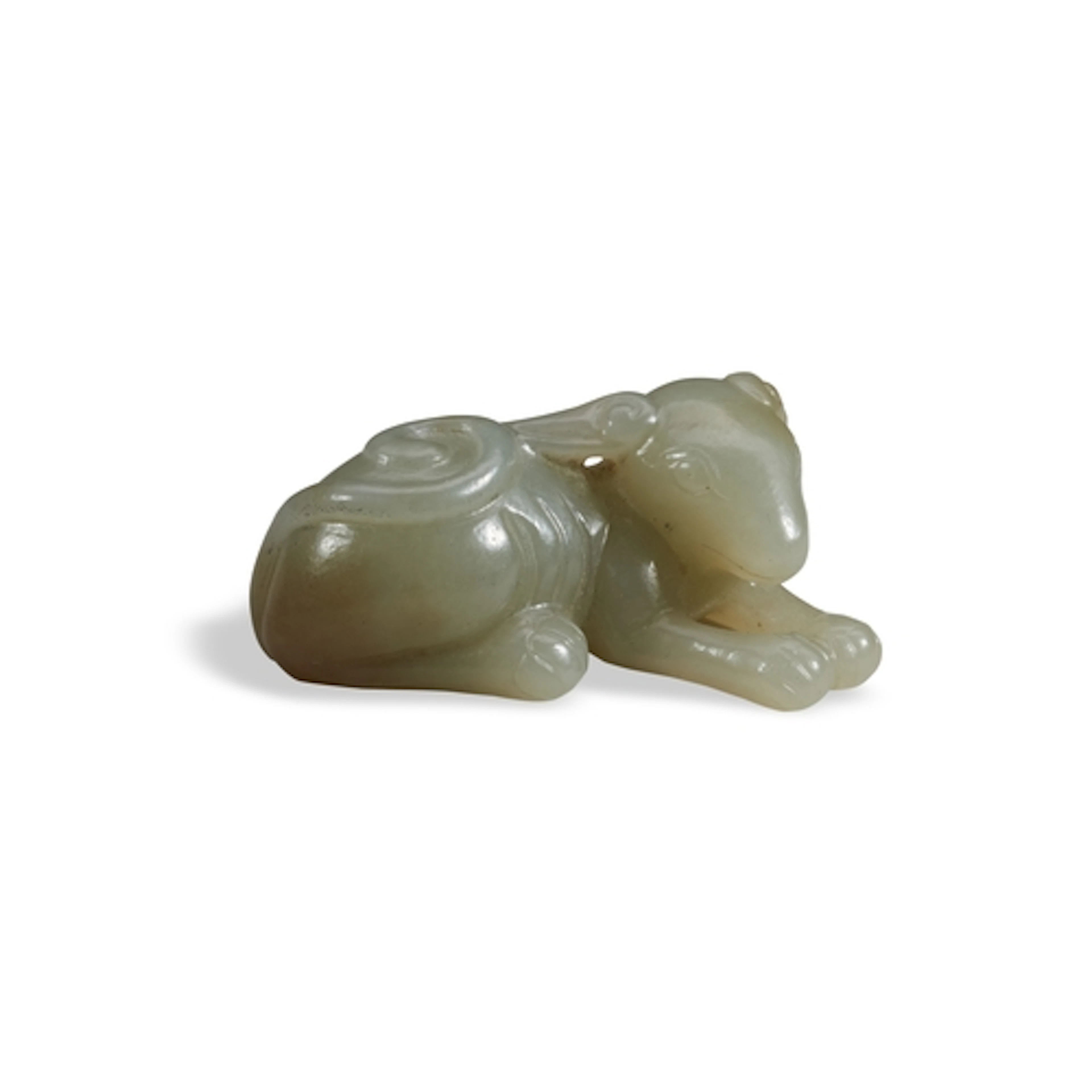 A PALE-CELADON JADE FIGURE OF A DOG 17TH / 18TH CENTURY 青灰玉...