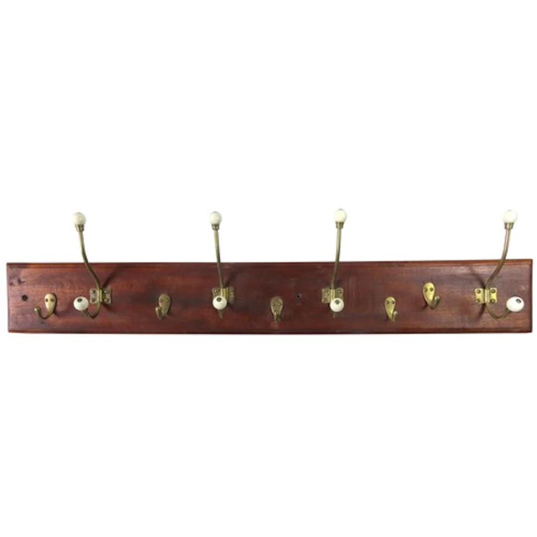 A WALL MOUNTED OAK COAT/HAT RACK four large brass hooks with...