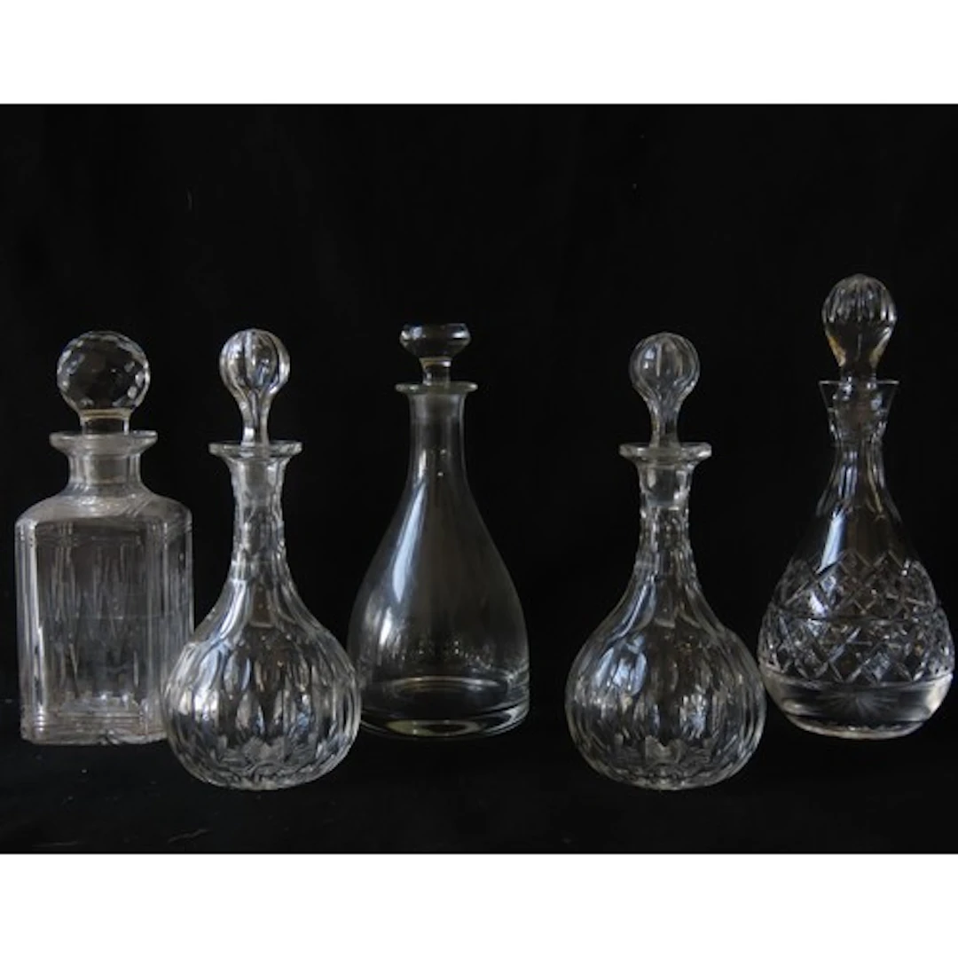 A PAIR OF EDWARDIAN CUT GLASS DECANTERS with globular stoppe...