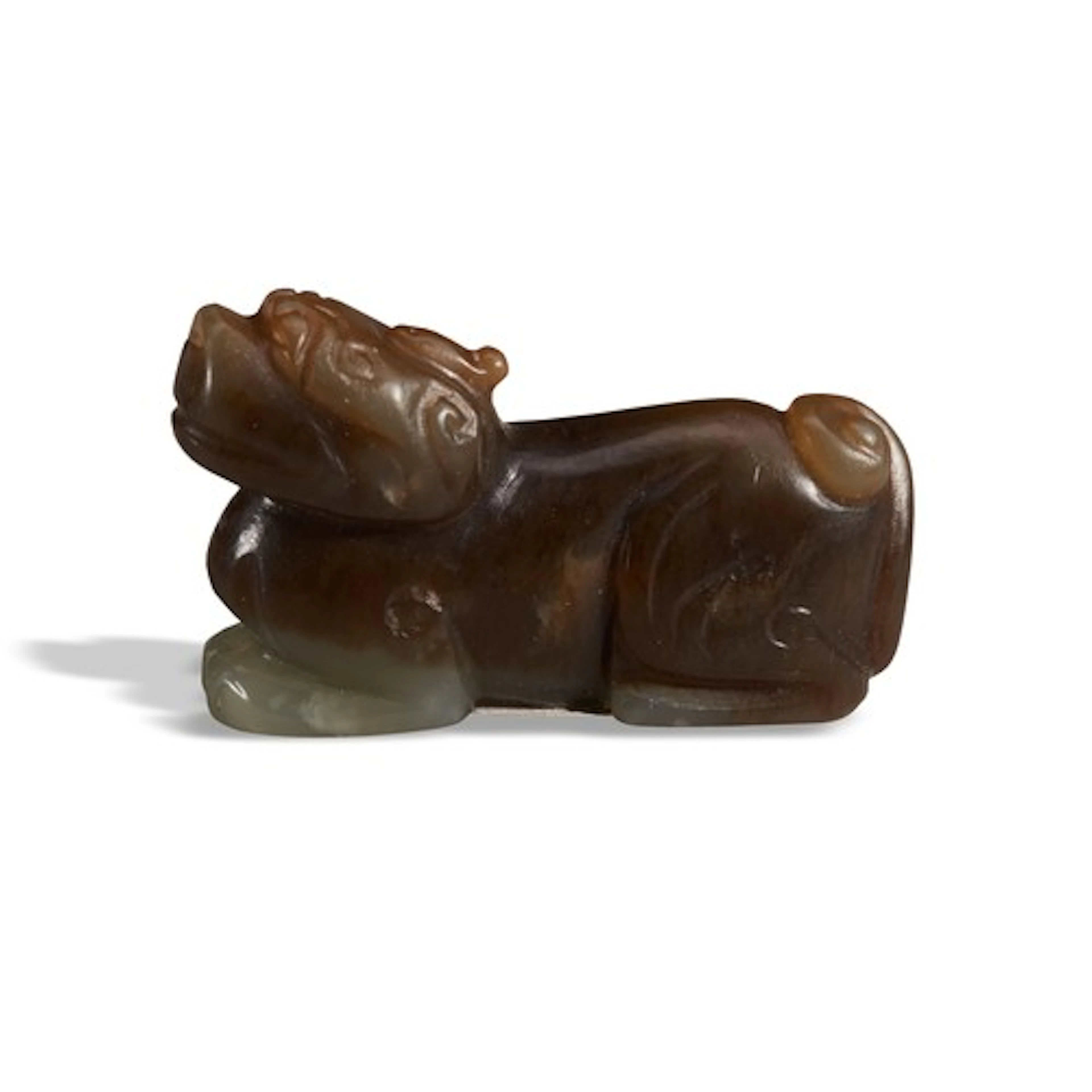 A BLACKISH-BROWN AND WHITE JADE LION MING DYNASTY (1368-1644...