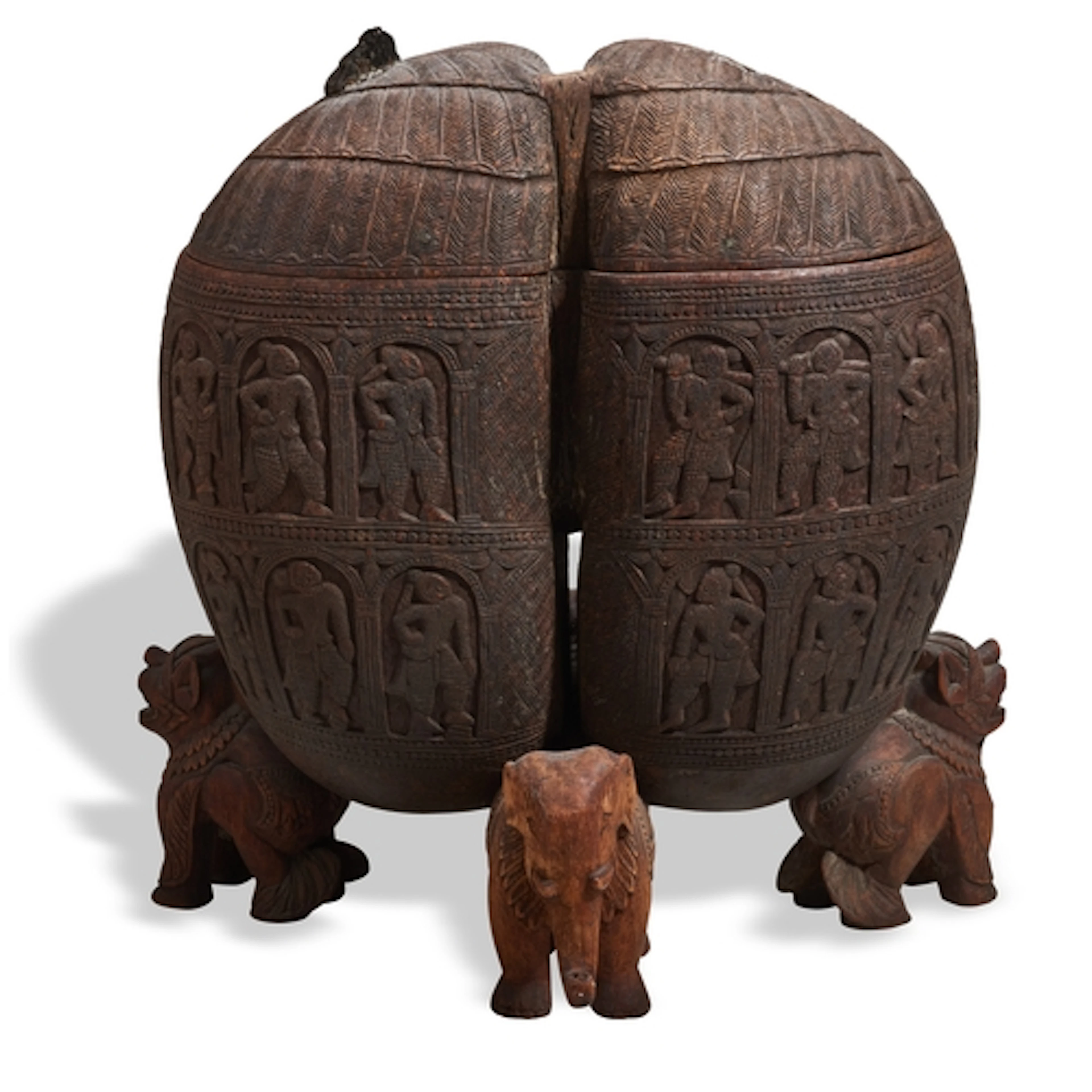A CARVED COCO-DE-MER (LODOICEA MALDIVICA) CONTAINER WEST IND...