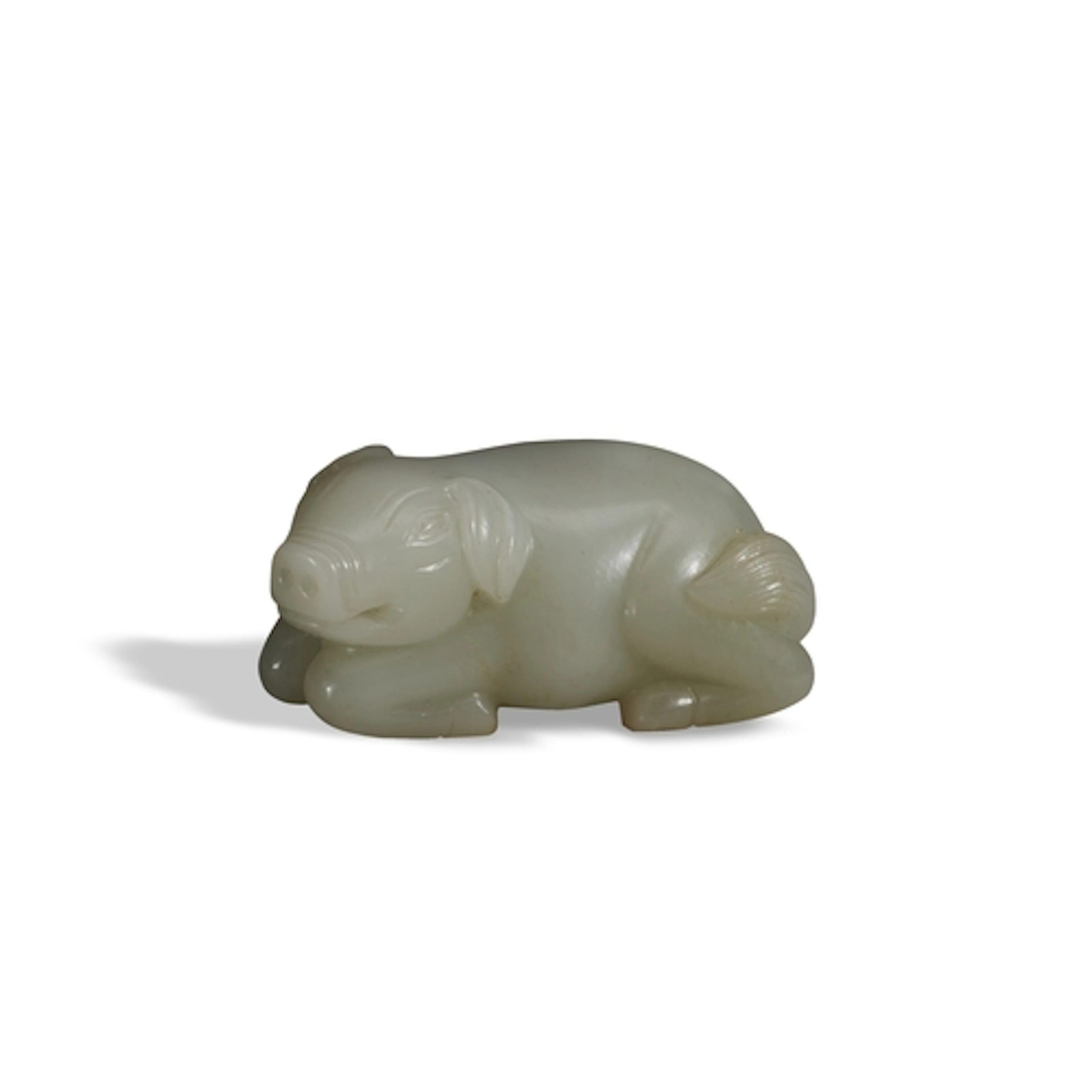 A FINE WHITE JADE CARVING OF A PIG QING DYNASTY, 19TH CENTUR...