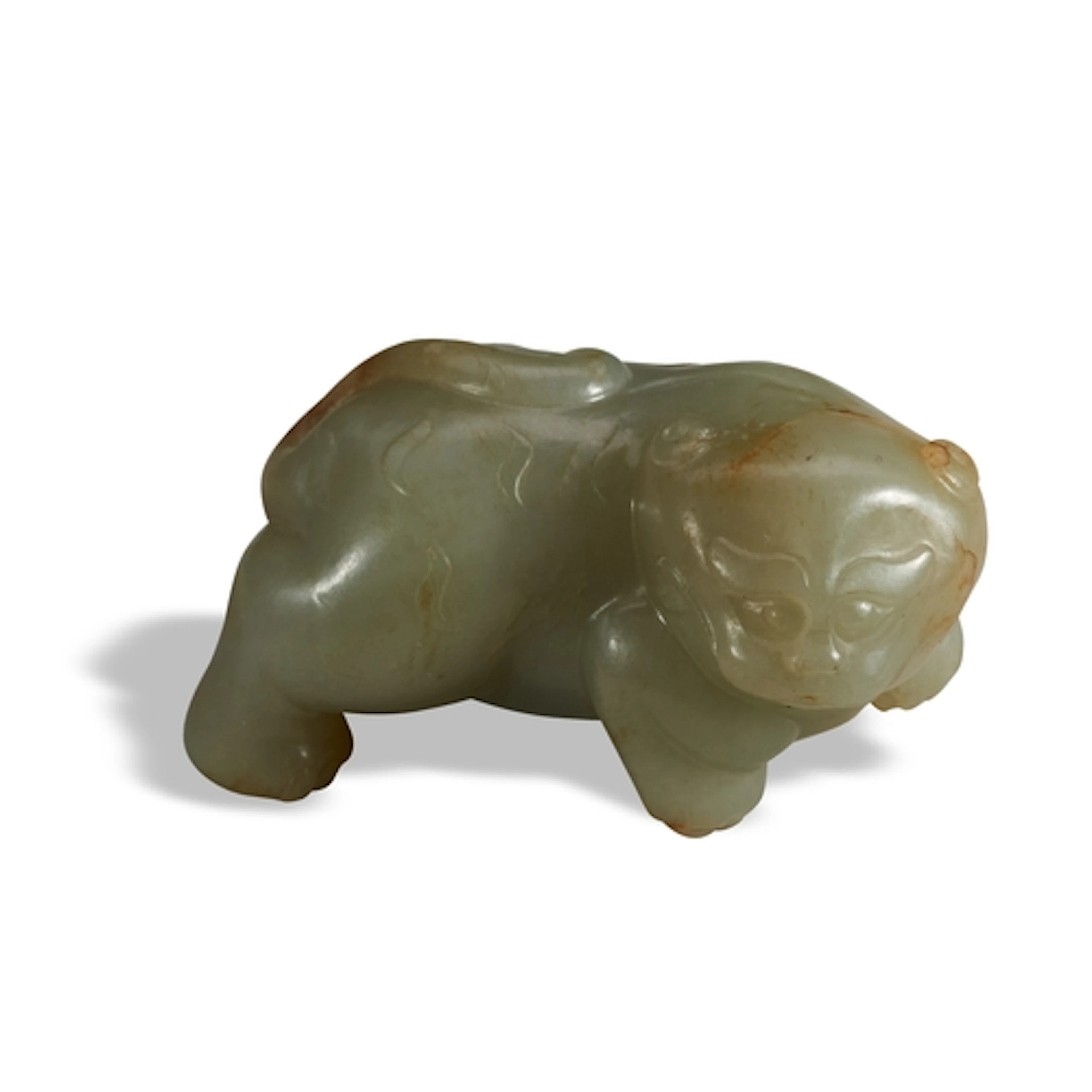 A CELADON AND RUSSET JADE ARCHAIC-STYLE LION QING DYNASTY, 1...