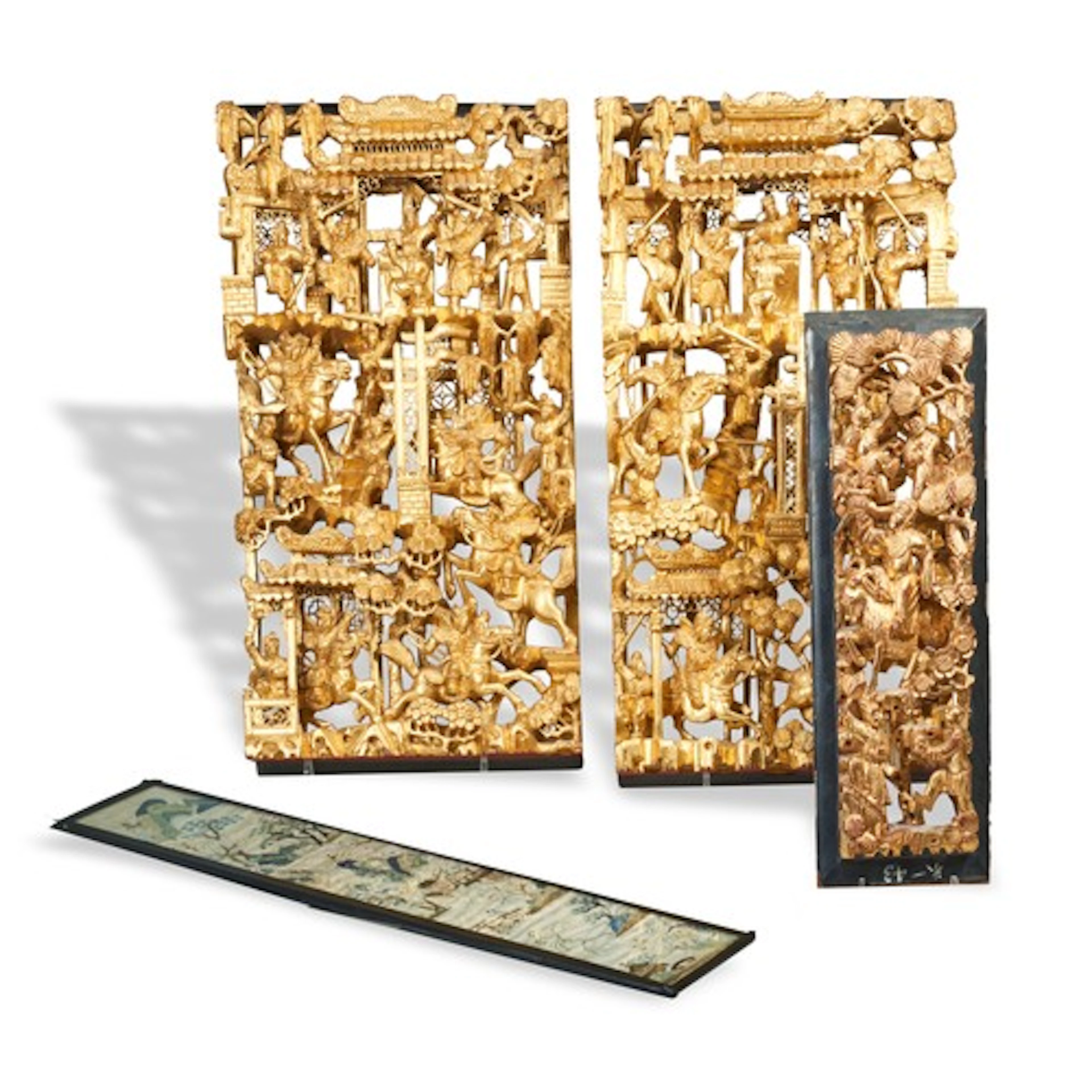 A GROUP OF THREE CHINESE CARVED GILTWOOD PANELS AND AN EMBRO...