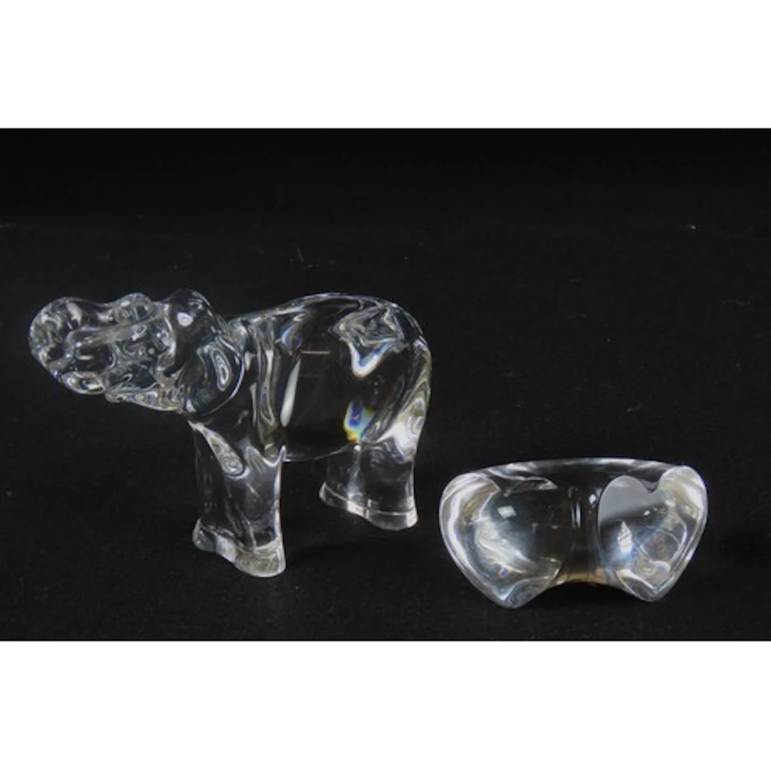 A BACCARAT GLASS MODEL OF AN ELEPHANT modelled standing four...