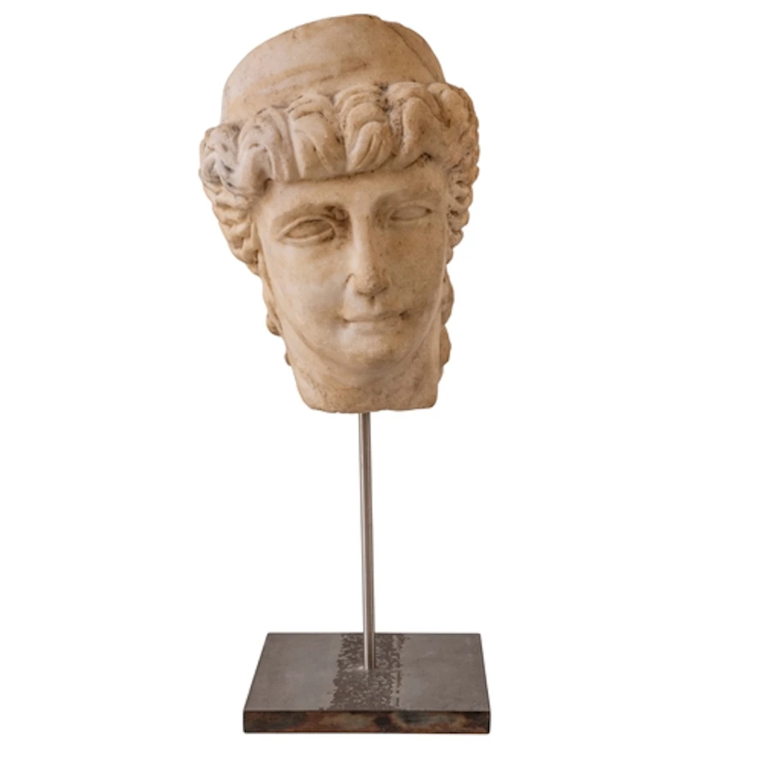 A GRECO-ROMAN STYLE MARBLE BUST depicting a female maiden or...