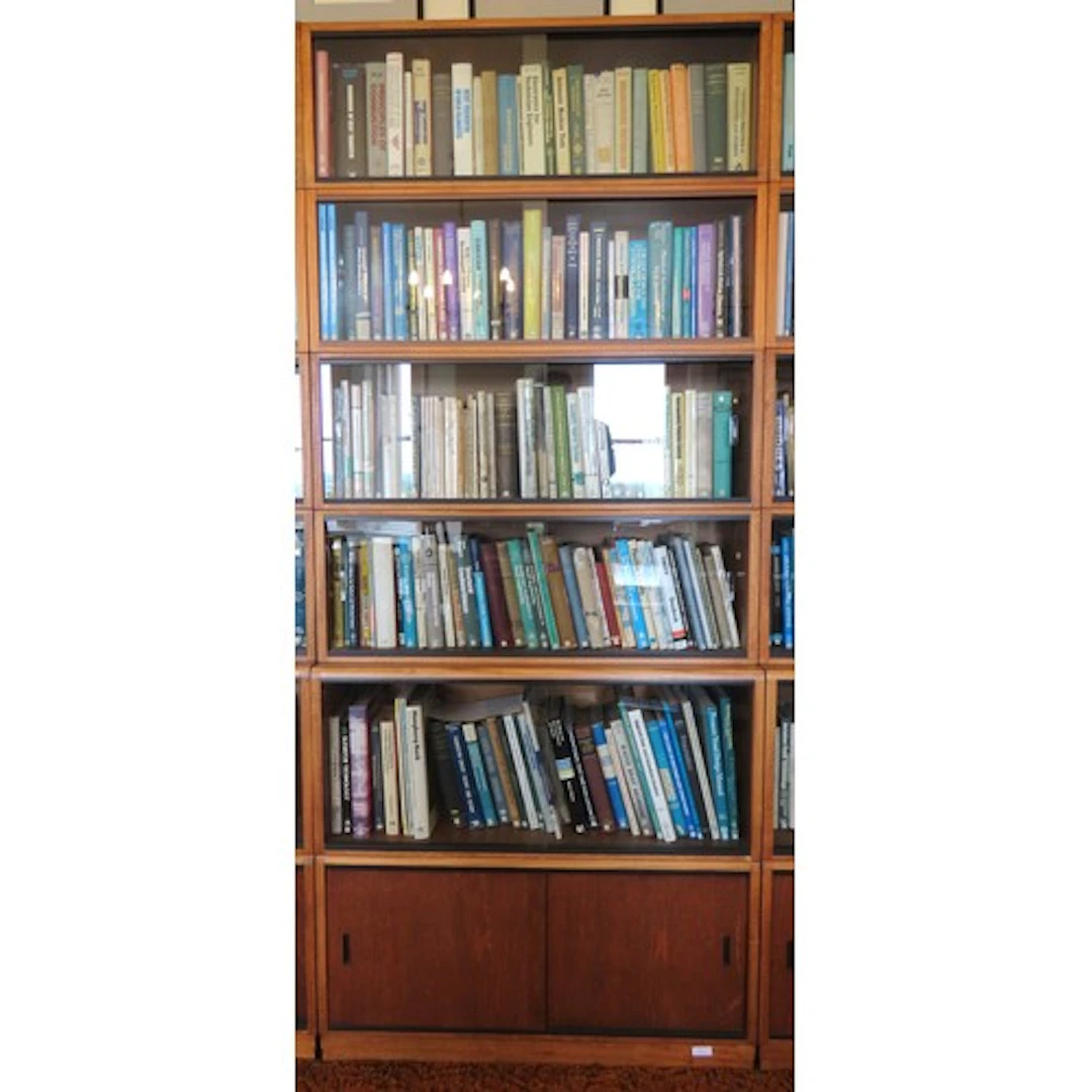 A SIMPLEX SECTIONAL LIBRARY BOOKCASE CIRCA 1965 comprised of...
