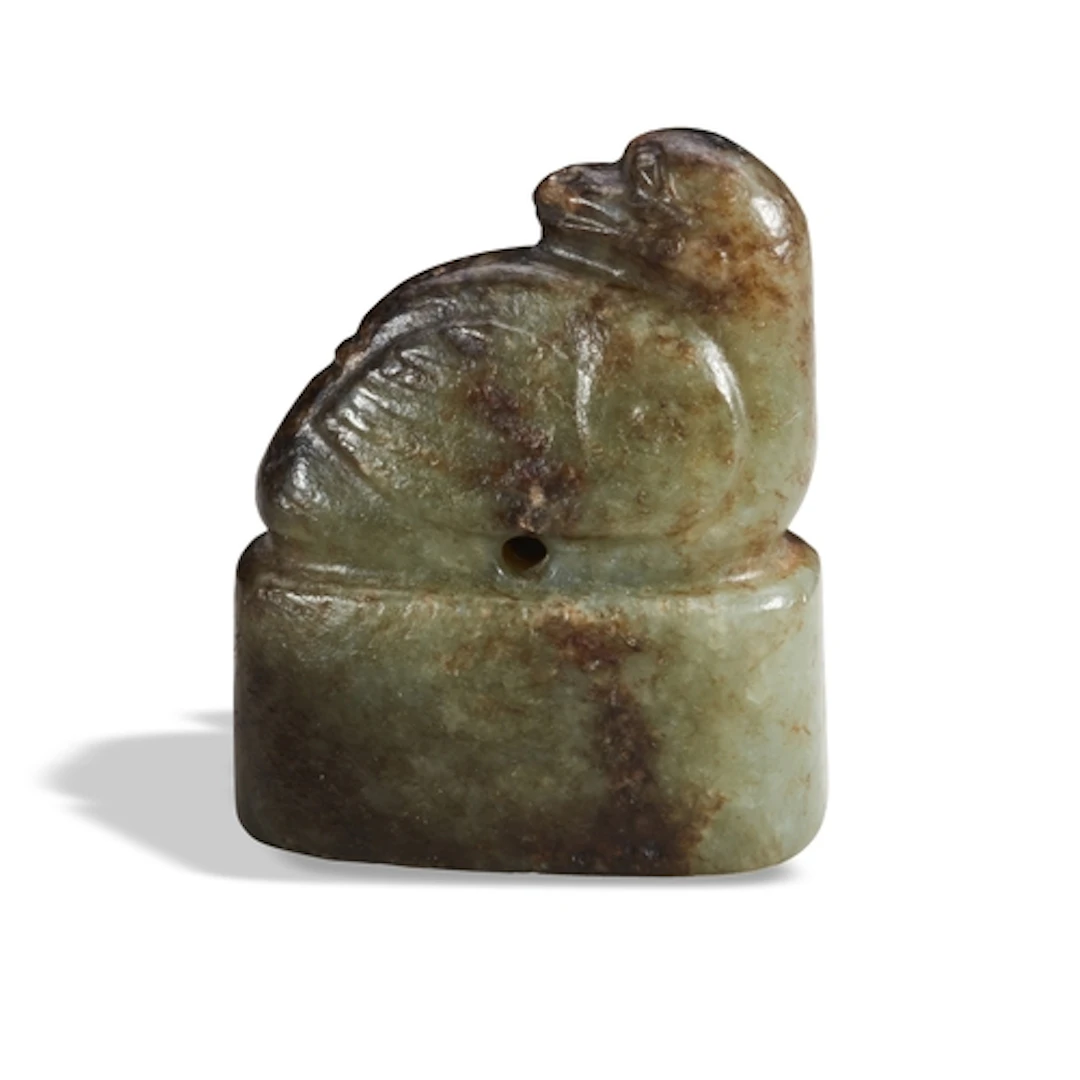 A MOTTLED BROWN-CELADON JADE 'BIRD' SEAL MING DYNASTY OR EA...