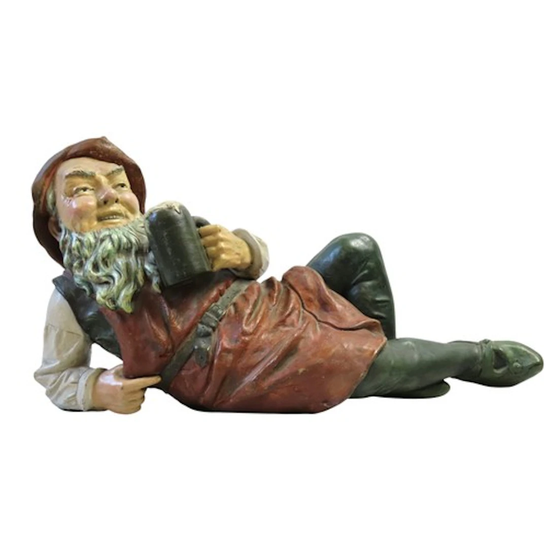 AN AUSTRIAN POLYCHROME PAINTED TERRACOTTA GNOME BY JOHANN MA...