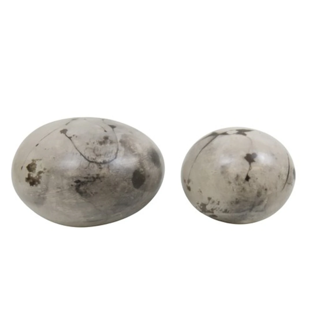 A CERAMIC PEBBLE FORM SCULPTURE of polished ovoid form with ...