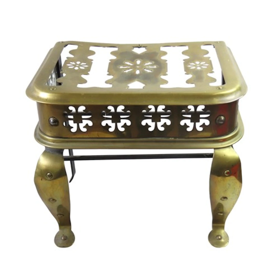 A 19TH CENTURY PIERCED BRASS AND CAST-IRON FOOTMAN with cabr...