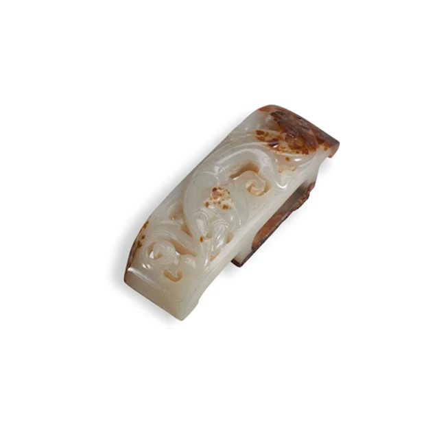A JADE 'CHILONG' SCABBARD SLIDE HAN OR LATER 螭龙纹白褐玉带钩 汉或以后 C...