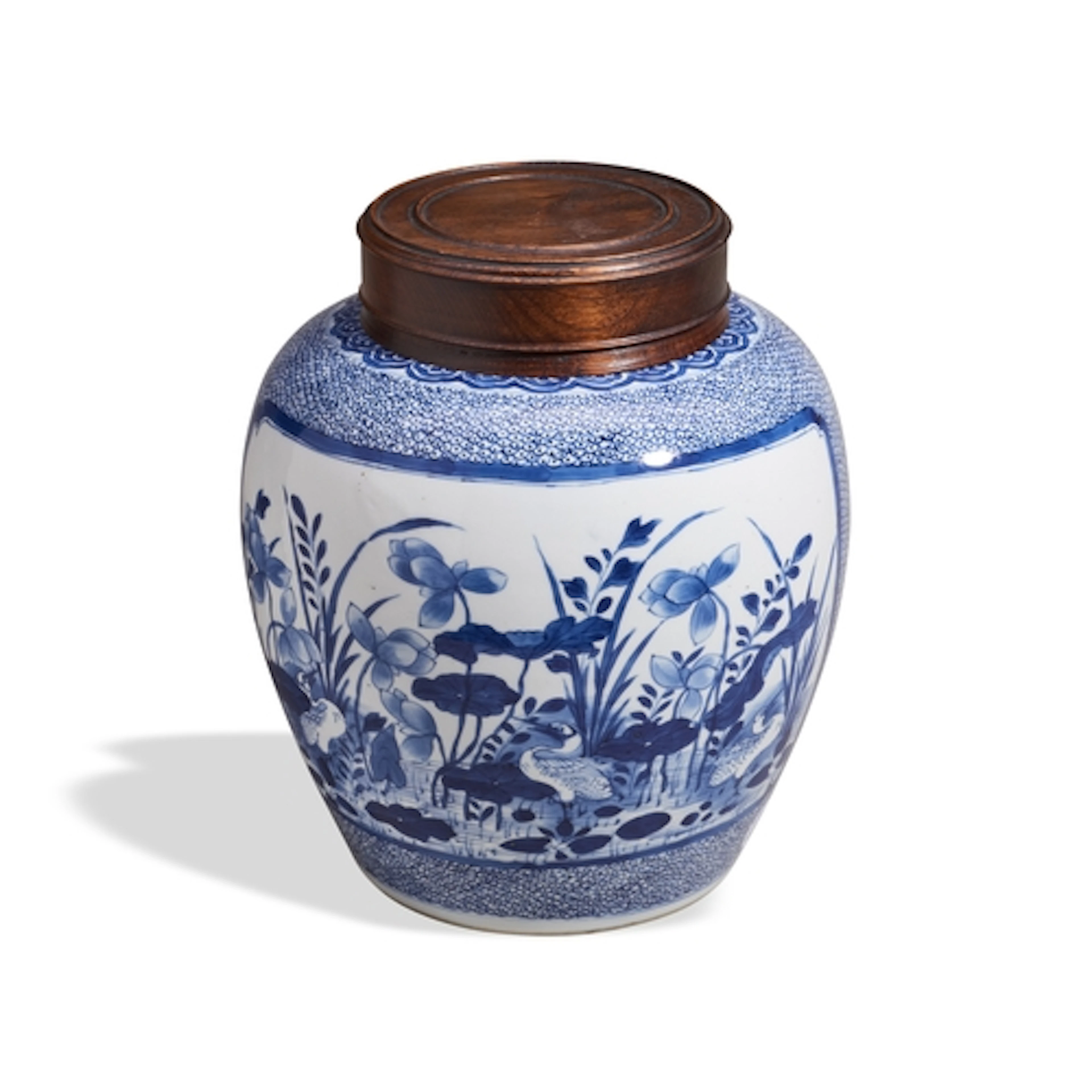 A BLUE AND WHITE ‘LOTUS POND’ JAR WITH WOODEN COVER KANGXI P...