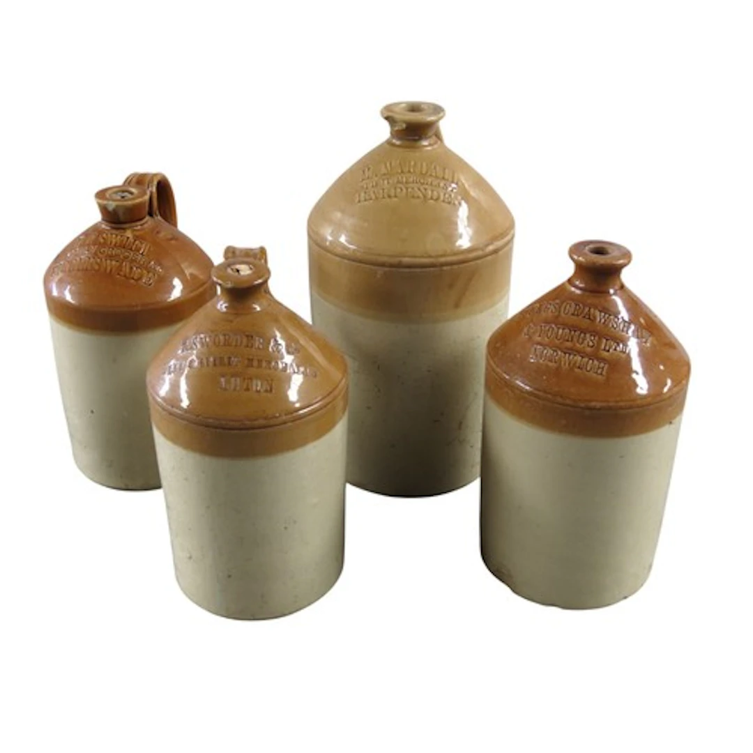 FOUR SALT GLAZED BREWERY JARS each one impressed with inscri...
