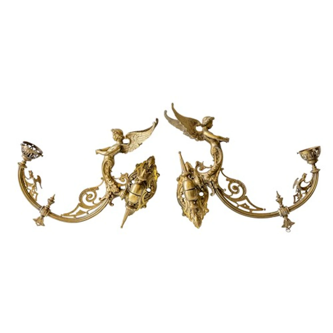 A PAIR OF FANCY BRASS GAS SCONCES ornately cast with winged ...