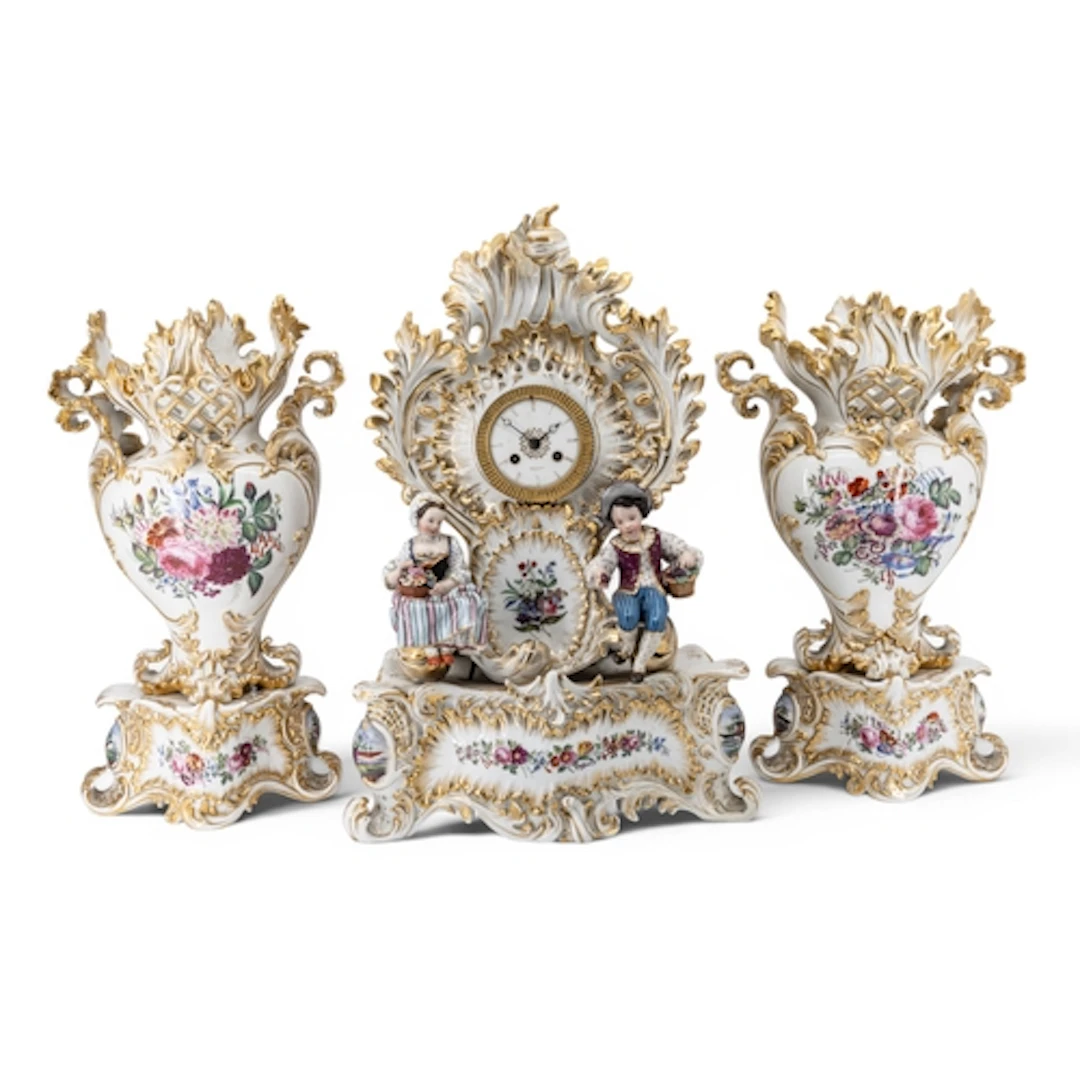 AN IMPRESSIVE AND ORNATE FRENCH PORCELAIN CLOCK GARNITURE th...