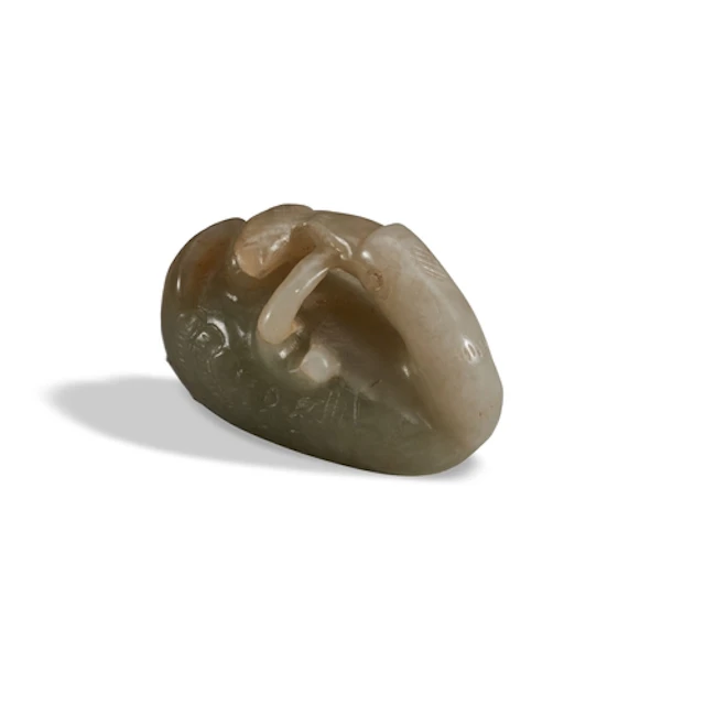 A MOTTLED CELADON JADE CARVED FIGURE OF A GOOSE QING DYNAST...