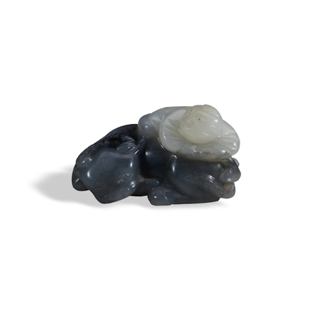 A GREY AND WHITE JADE BUFFALO AND BOY GROUP QING DYNASTY, 19...