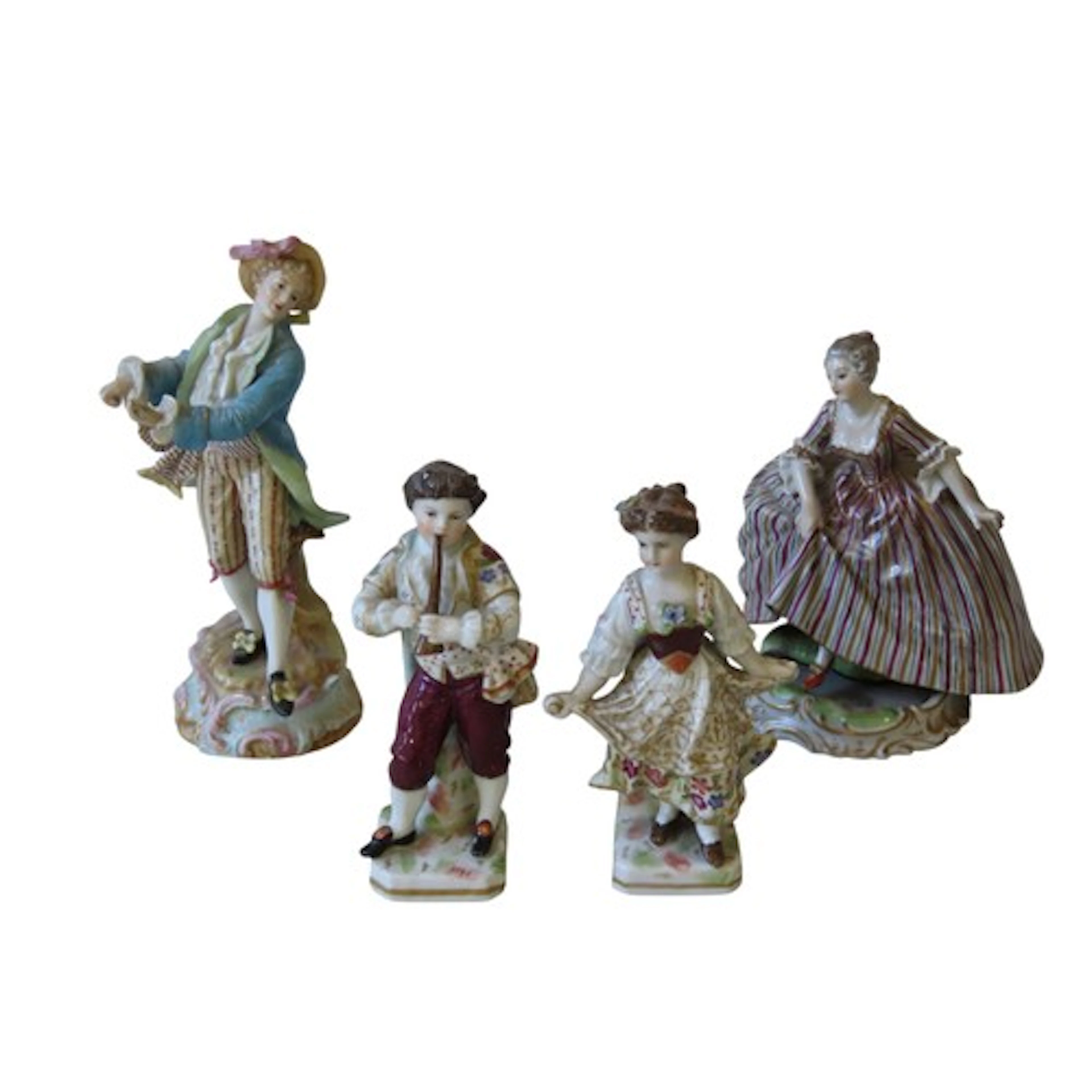 A 19TH CENTURY VIENNA FIGURINE OF LADY HITCHING HER DRESS st...