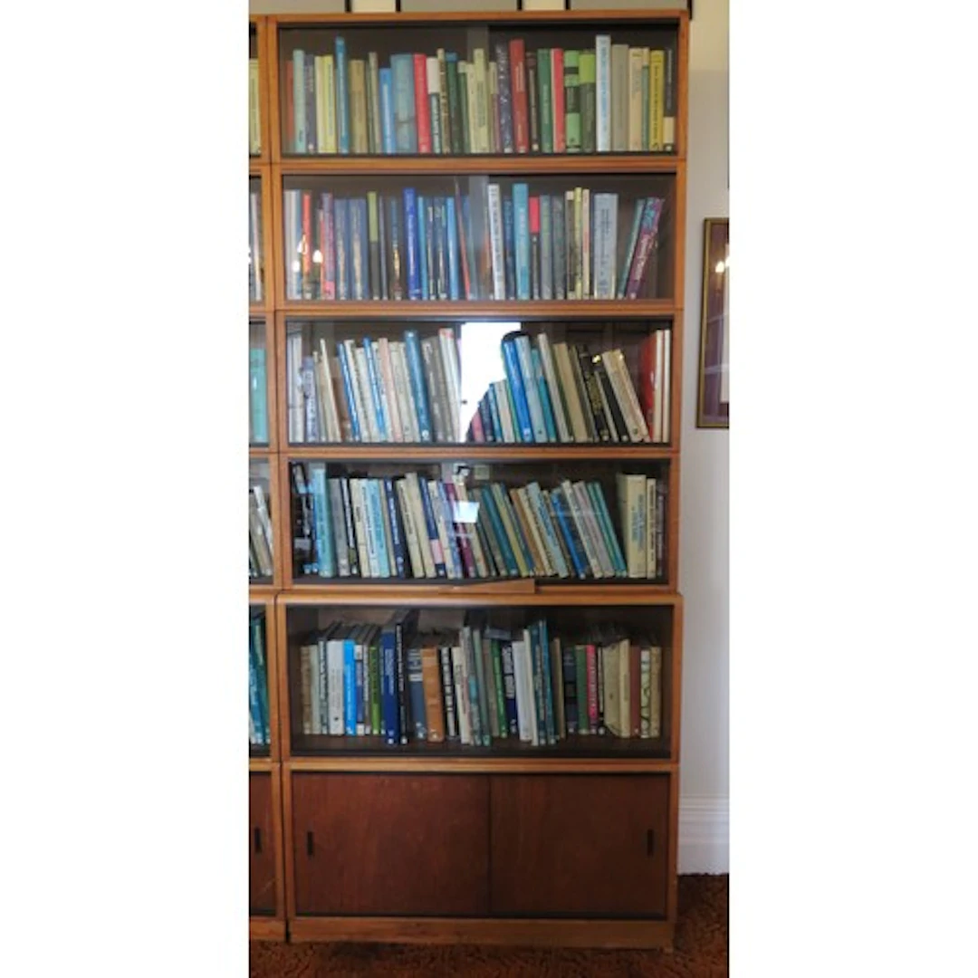 A SIMPLEX SECTIONAL LIBRARY BOOKCASE CIRCA 1965 comprised of...