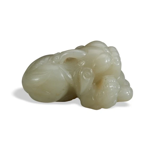 A CELADON JADE HORNED LION GROUP 19TH / 20TH CENTURY 青白玉狮 清 ...