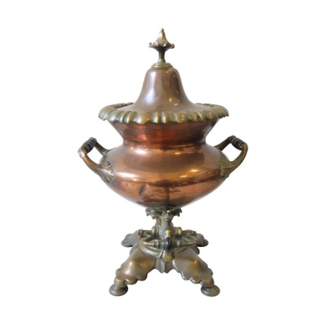 A 19TH CENTURY COPPER SAMOVAR the boat form body flanked by ...