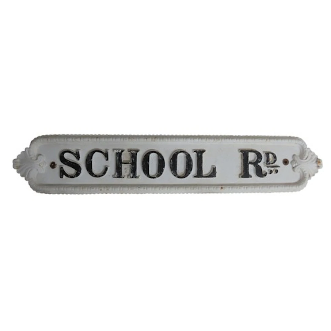 A CAST-IRON STREET SIGN inscribed 'School Rd' within a beade...