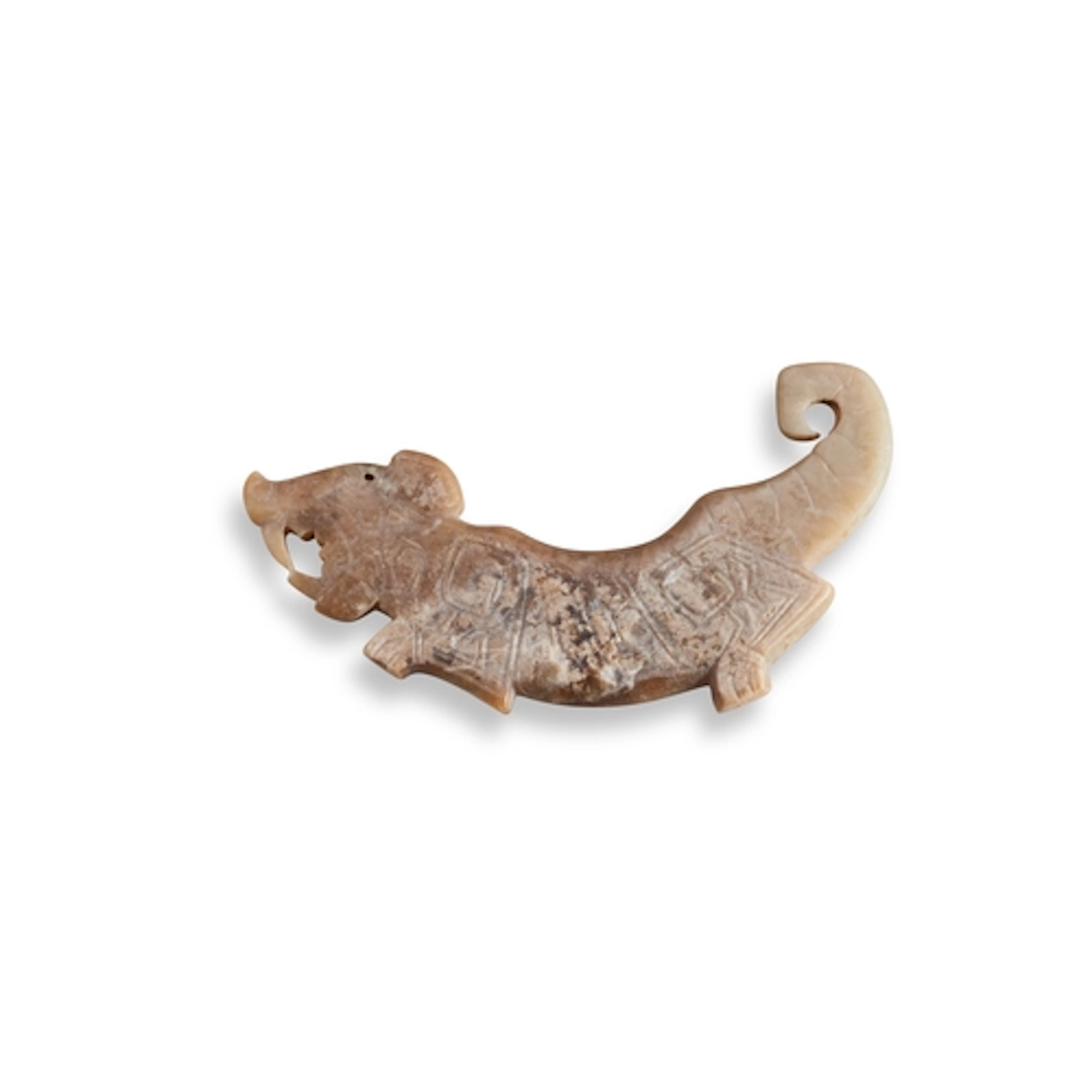 A CALCIFIED JADE 'TIGER' PENDANT WESTERN ZHOU DYNASTY OR LAT...