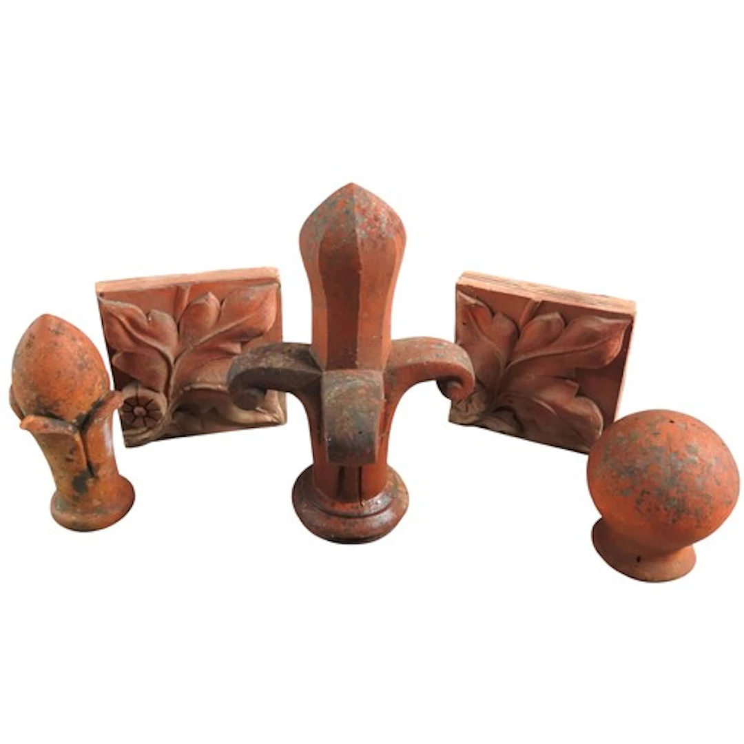 THREE TERRACOTTA FINIALS AND TWO TILES Tallest finial: 41 cm...