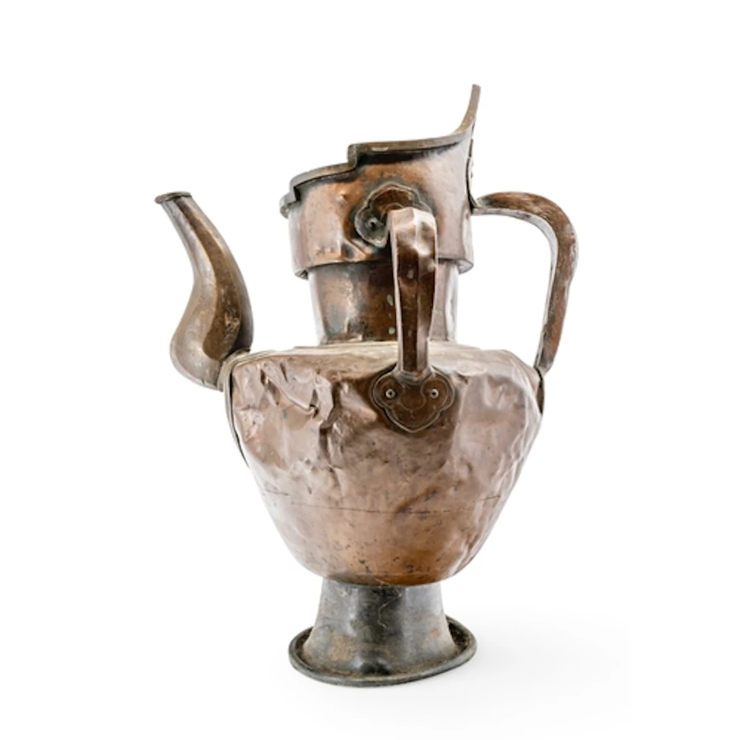 A TIBETAN COPPER 'MONK'S CAP' EWER 19TH CENTURY 57.5 cm high...