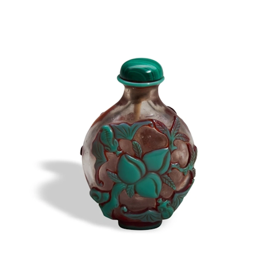 A GREEN-OVERLAY PINK GLASS SNUFF BOTLLE LATE QING DYNASTY th...